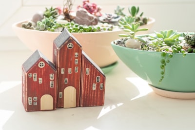 brown wooden house miniature on white table decorate google meet background