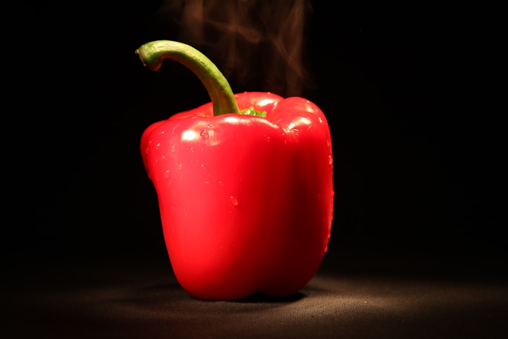 red bell pepper on black textile