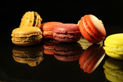 six red and yellow macaroons