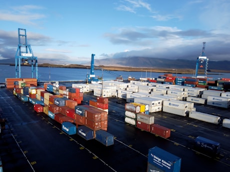 Stacks of export crates ready for shipment with a backdrop of the Nile River.