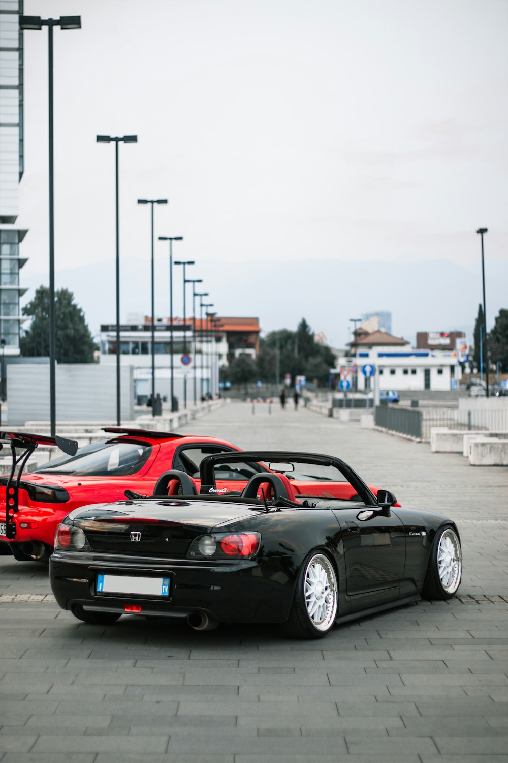 red ferrari 458 italia on road during daytime