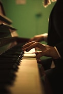 person playing piano inside room
