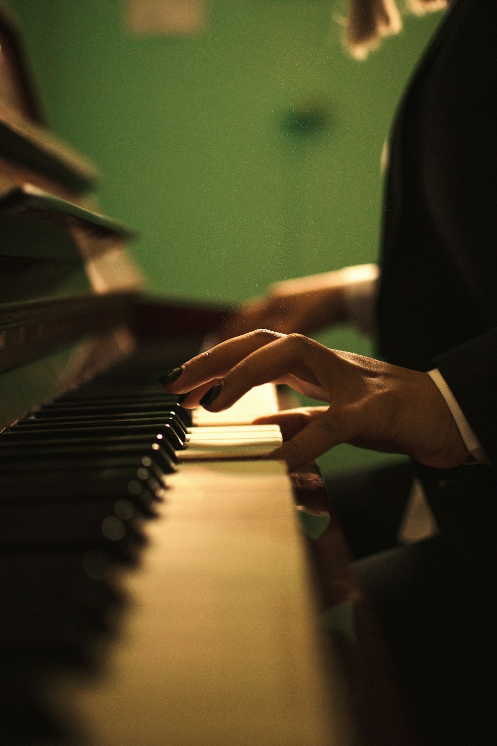 person playing piano inside room