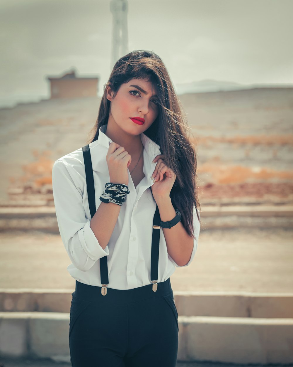 woman in white dress shirt and black dress pants