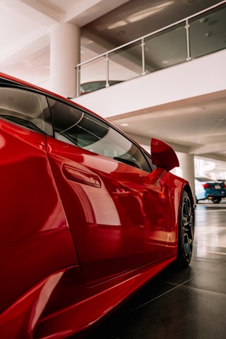 red car parked in a parking lot