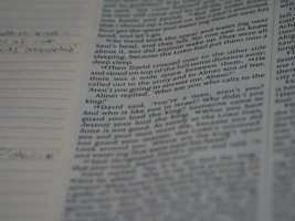 Close-up of an open journal article with handwritten notes on the side