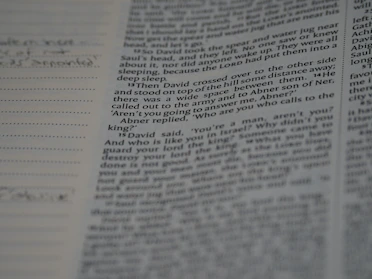 Close-up of an open book with handwritten notes in the margins.