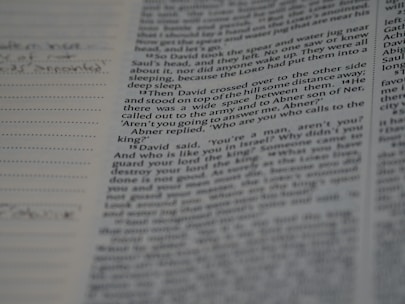 Close-up of an open book with handwritten notes in the margins.