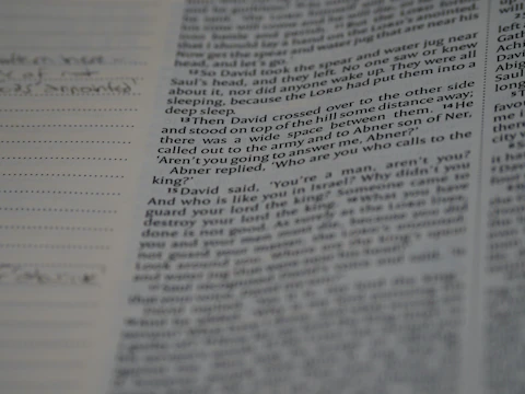 A close-up of an open anthropology book with handwritten notes in the margins.