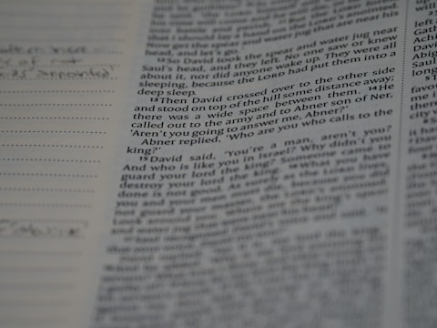 A close-up of a script with handwritten notes and highlights.