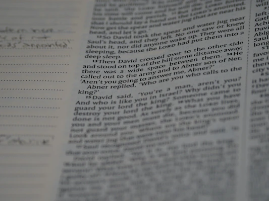 Close-up of a handwritten manuscript page with elegant penmanship and notes in the margins.