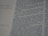 Close-up of hands editing a printed manuscript with a pen and notes.