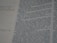 Close-up of hands editing a printed manuscript with a pen and notes.