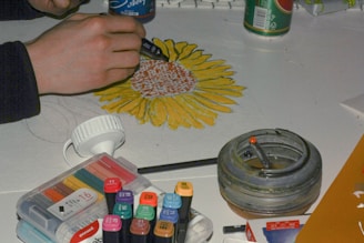 person holding blue and yellow hair brush