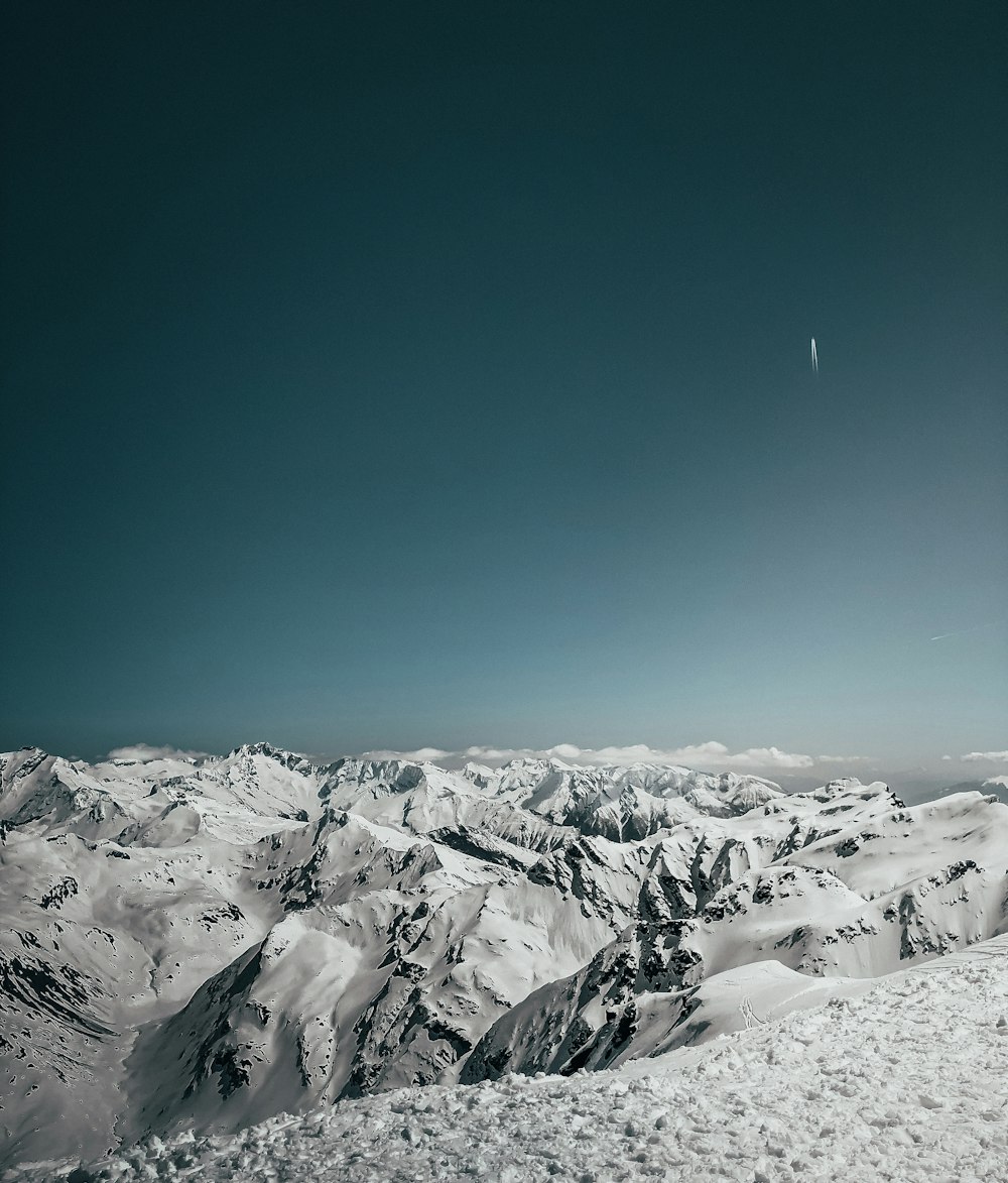 snow covered mountain under blue sky during daytime