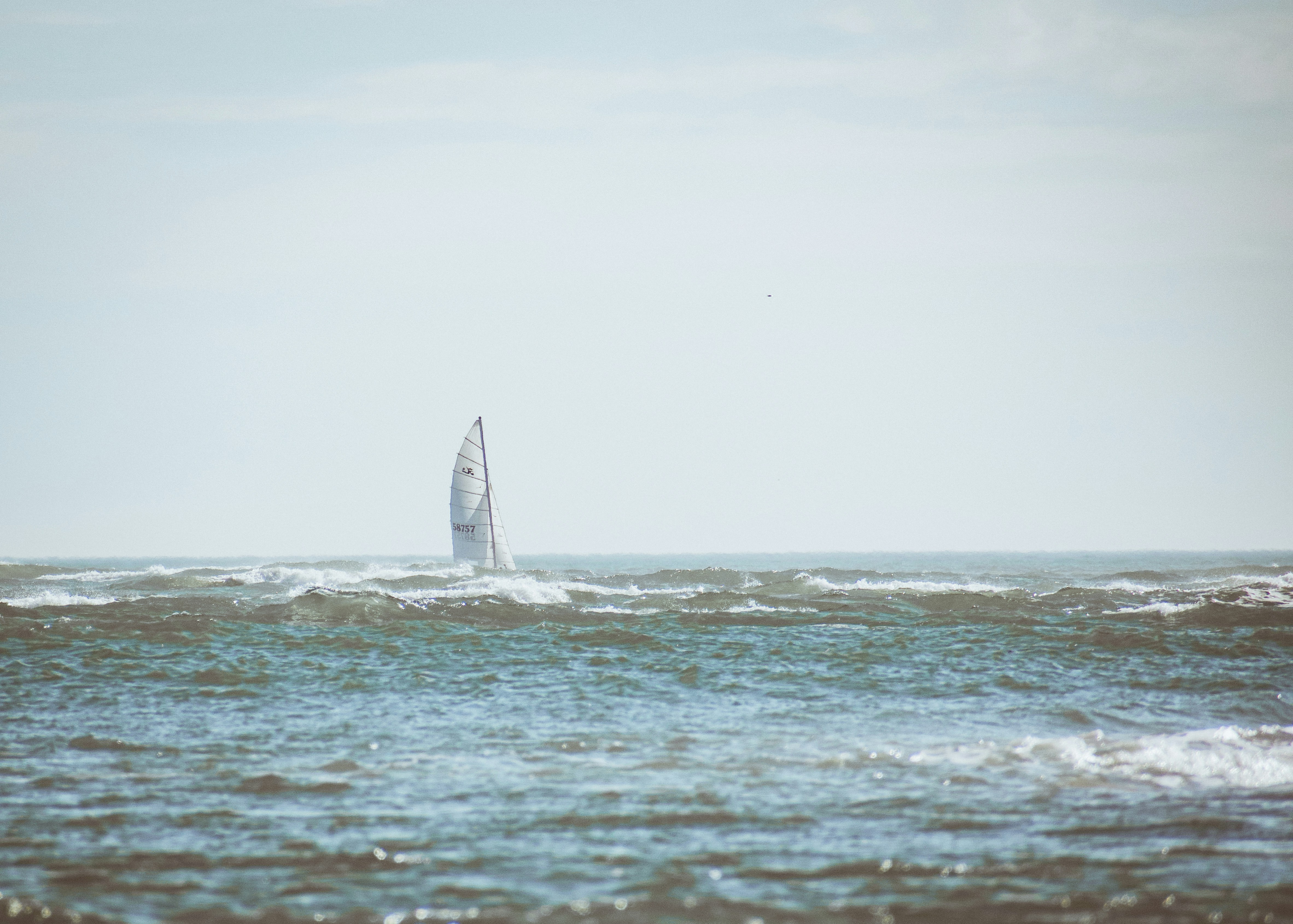 sailboat on sea during daytime