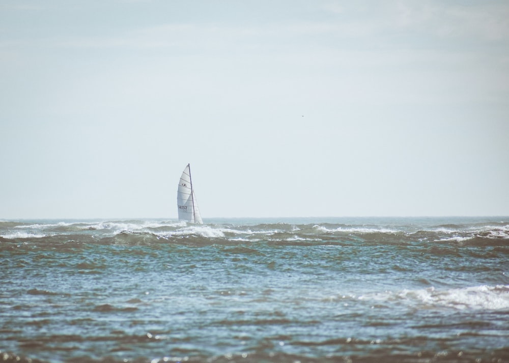 sailboat on sea during daytime