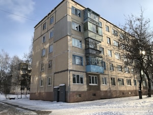 brown concrete building under blue sky during daytime