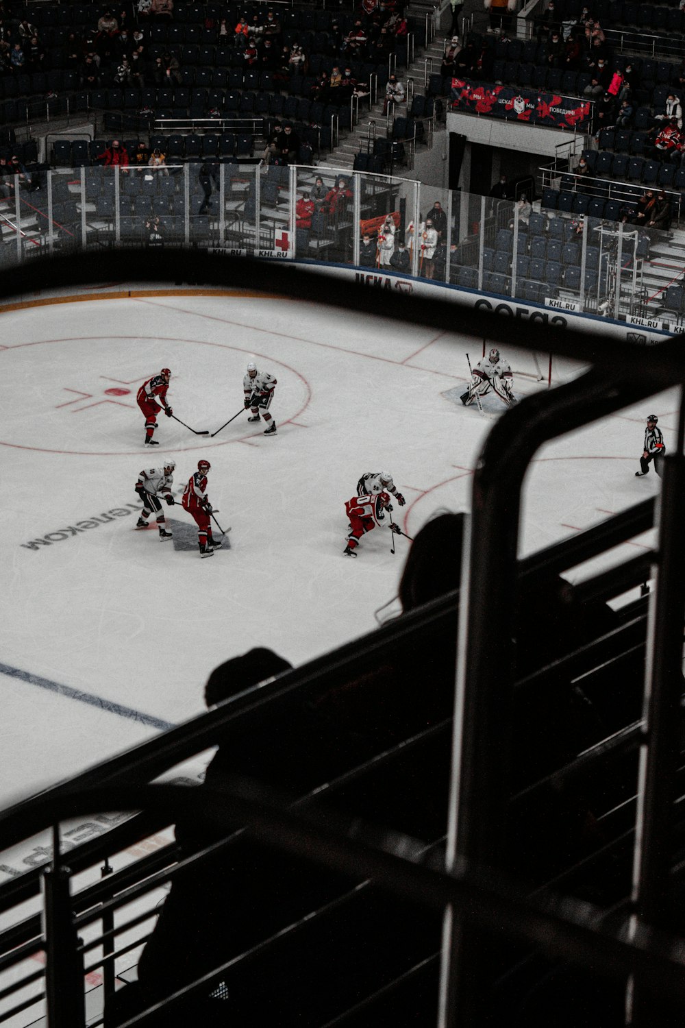 people playing ice hockey on ice stadium