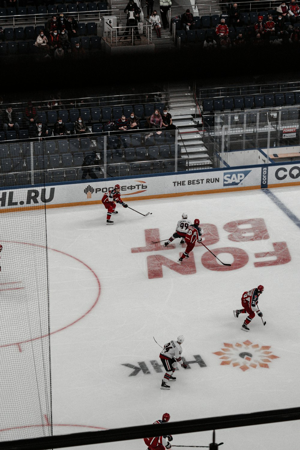 people playing ice hockey on ice hockey field