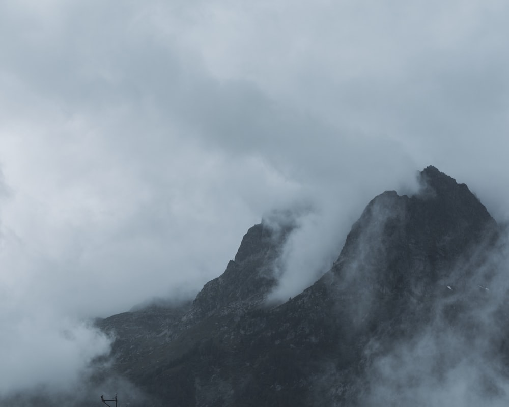 black and gray mountain under white clouds