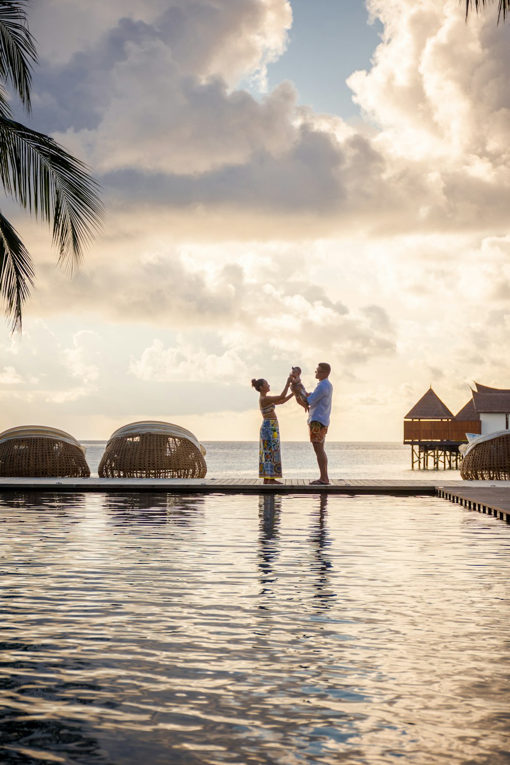 couple kissing on the beach during sunset