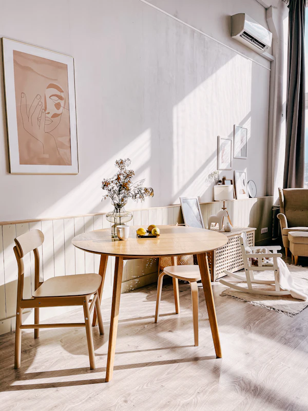 A finished wooden table with chairs