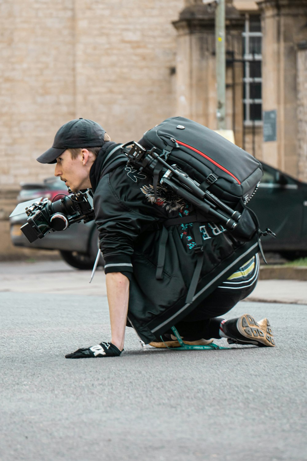 man in black leather jacket and black pants with black and brown leather backpack