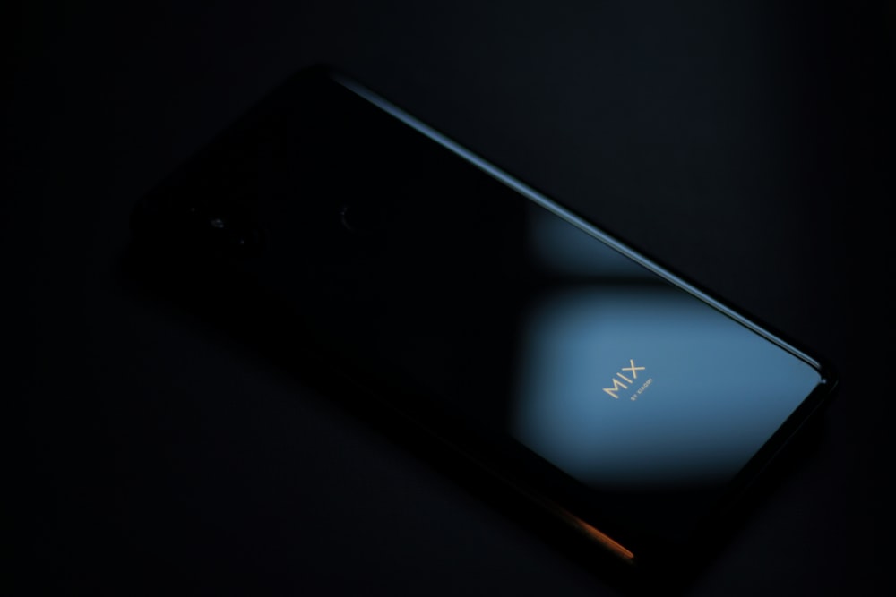 black ipod touch on black surface