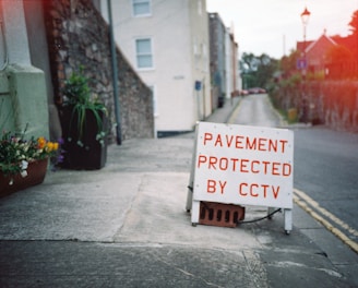 white and red signage on gray concrete floor