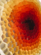 Close-up of a vibrant geometric tile pattern in warm earth tones.