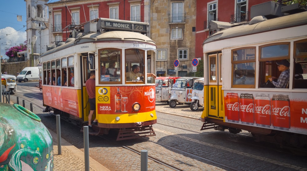 yellow and white tram on the street