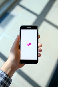 person holding black iphone 5