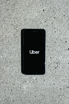 A smartphone displaying a ride-sharing app interface.