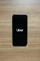 A smartphone showing the 99taxi app with a ride in progress