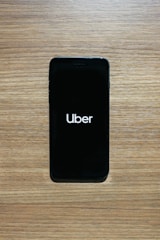 A close-up view of a smartphone displaying the Uber Eats registration screen.