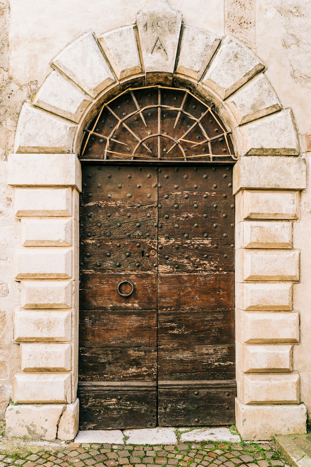 brown wooden door on gray concrete brick wall