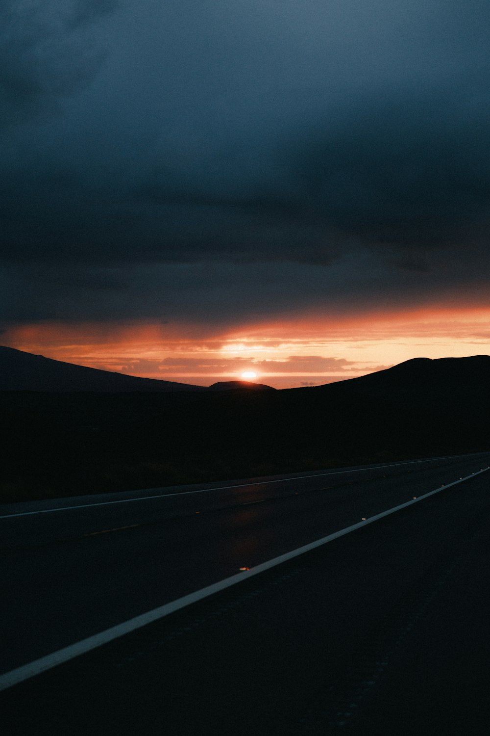 black asphalt road during sunset