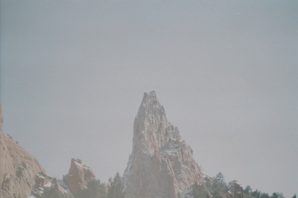 brown rocky mountain under white sky during daytime