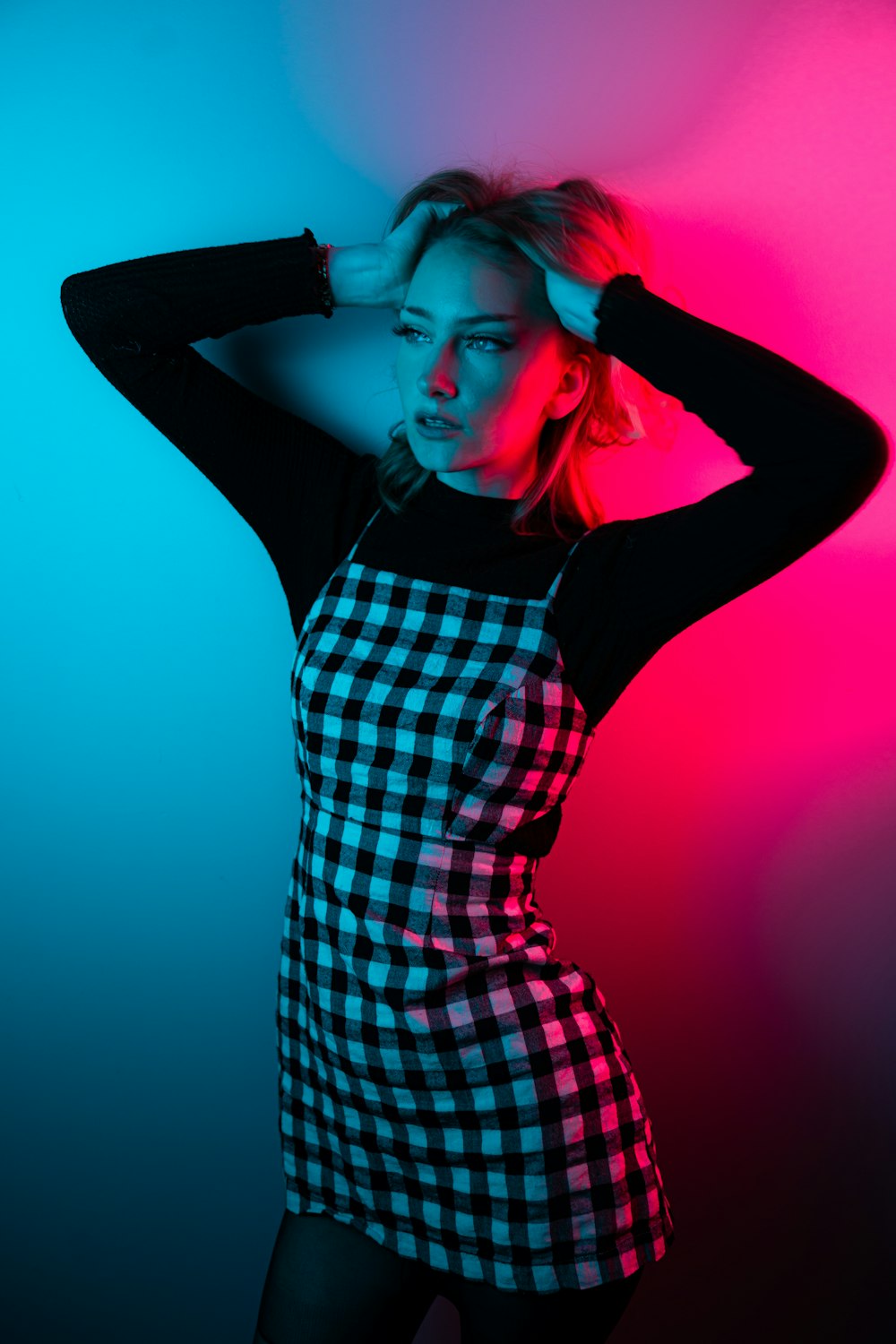 woman in black and white checkered dress