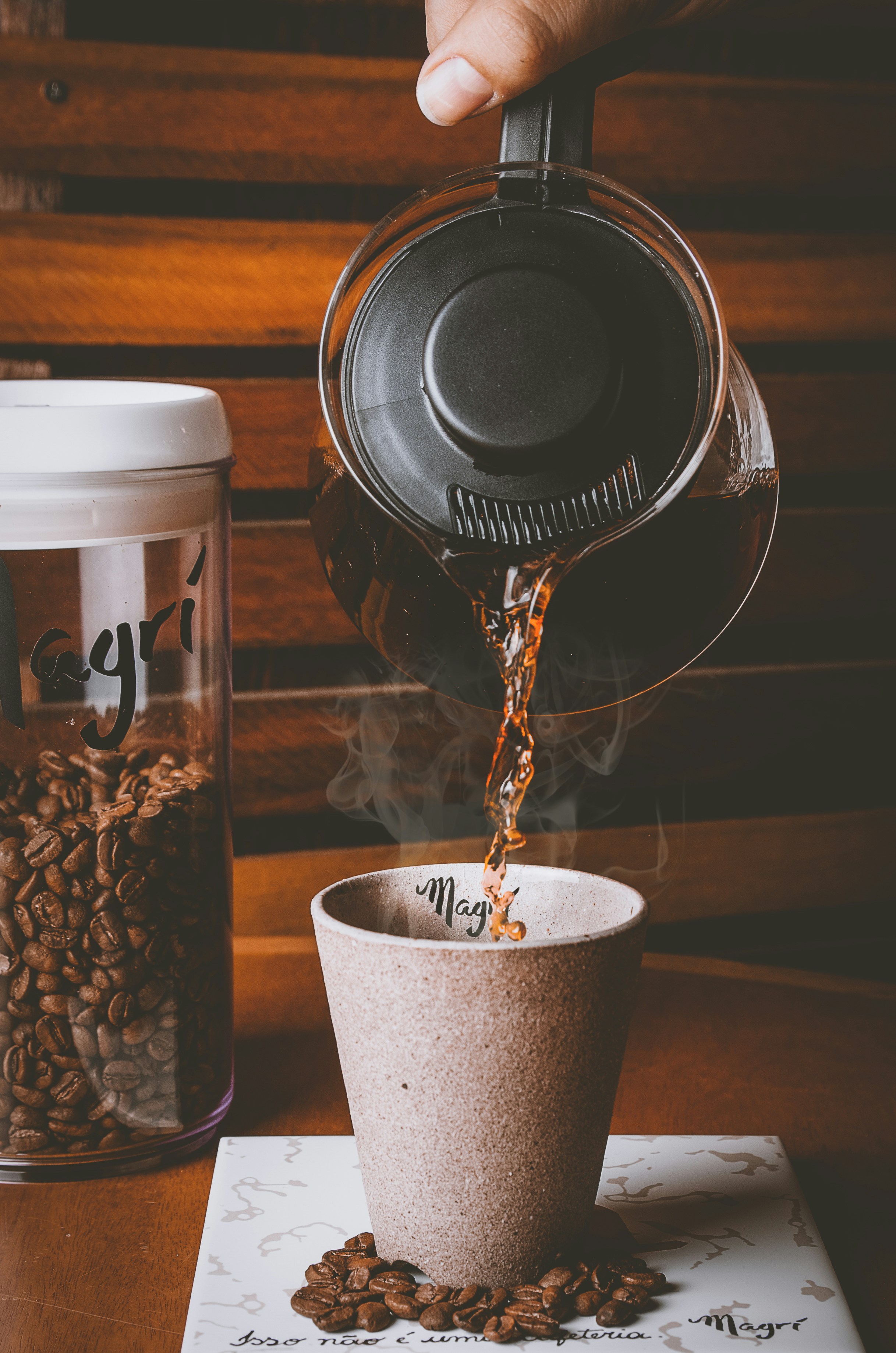 white coffee cup on brown wooden table