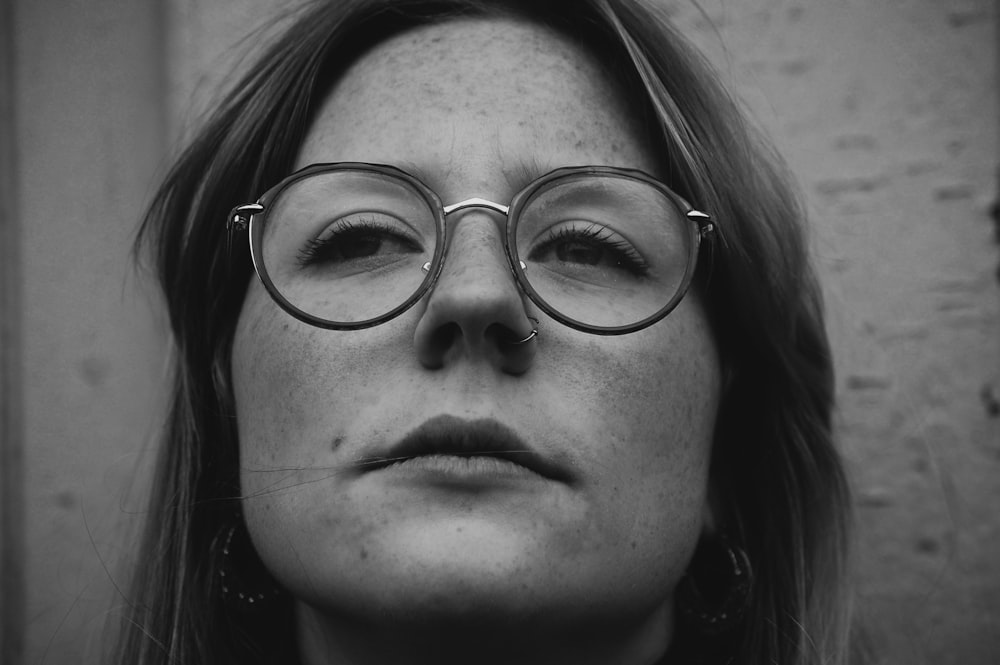 grayscale photo of woman wearing eyeglasses