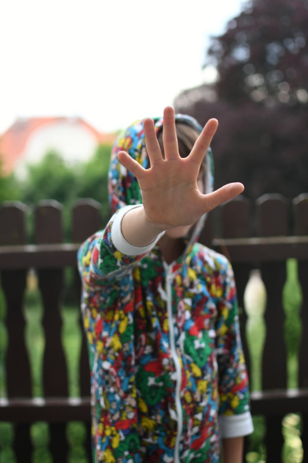 girl in white blue and red floral long sleeve shirt