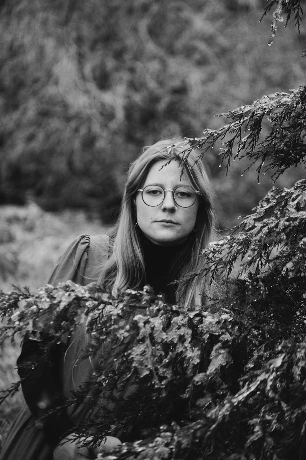 grayscale photo of woman in black and white shirt