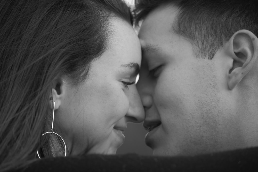 grayscale photo of couple kissing