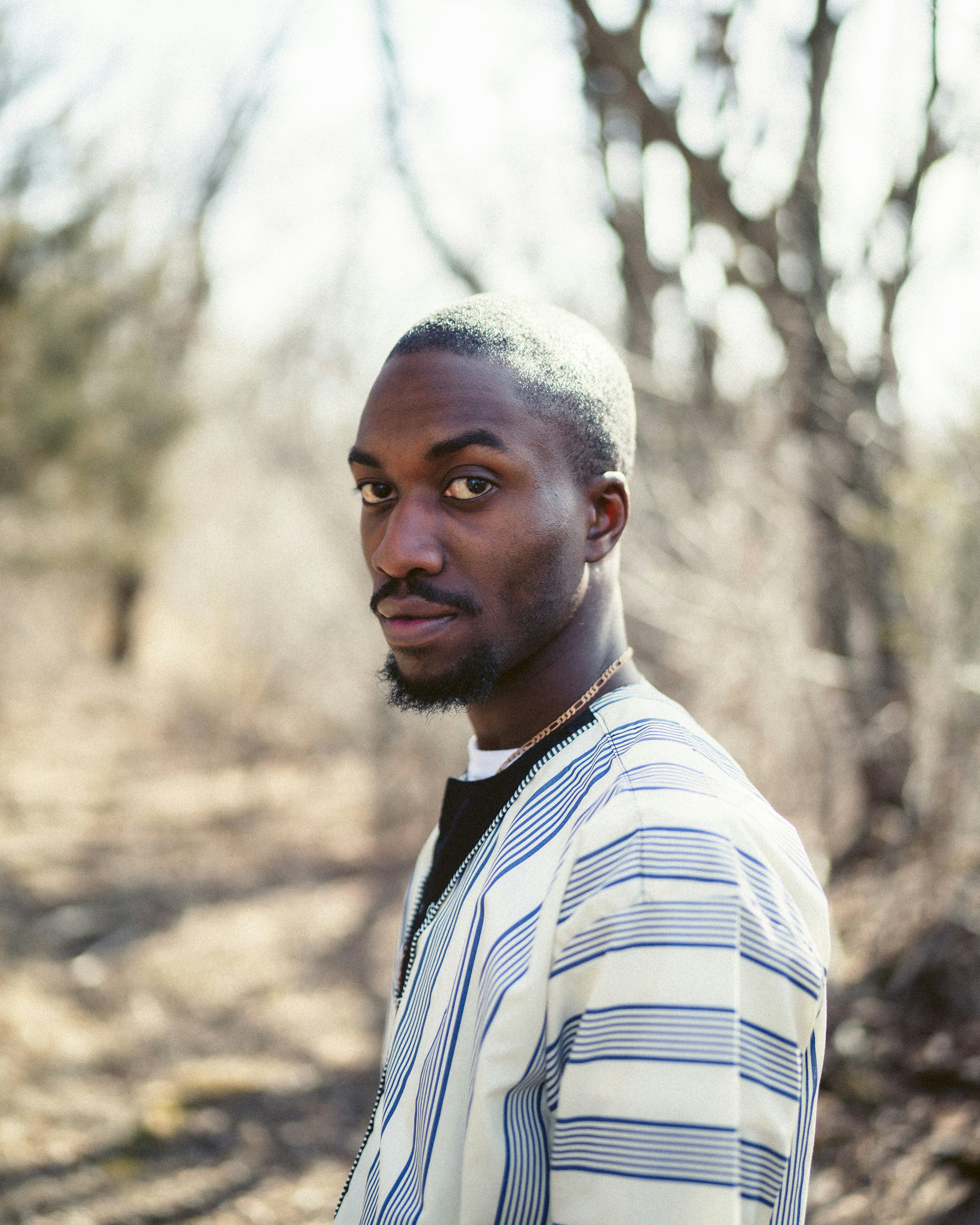 man in white and black striped dress shirt