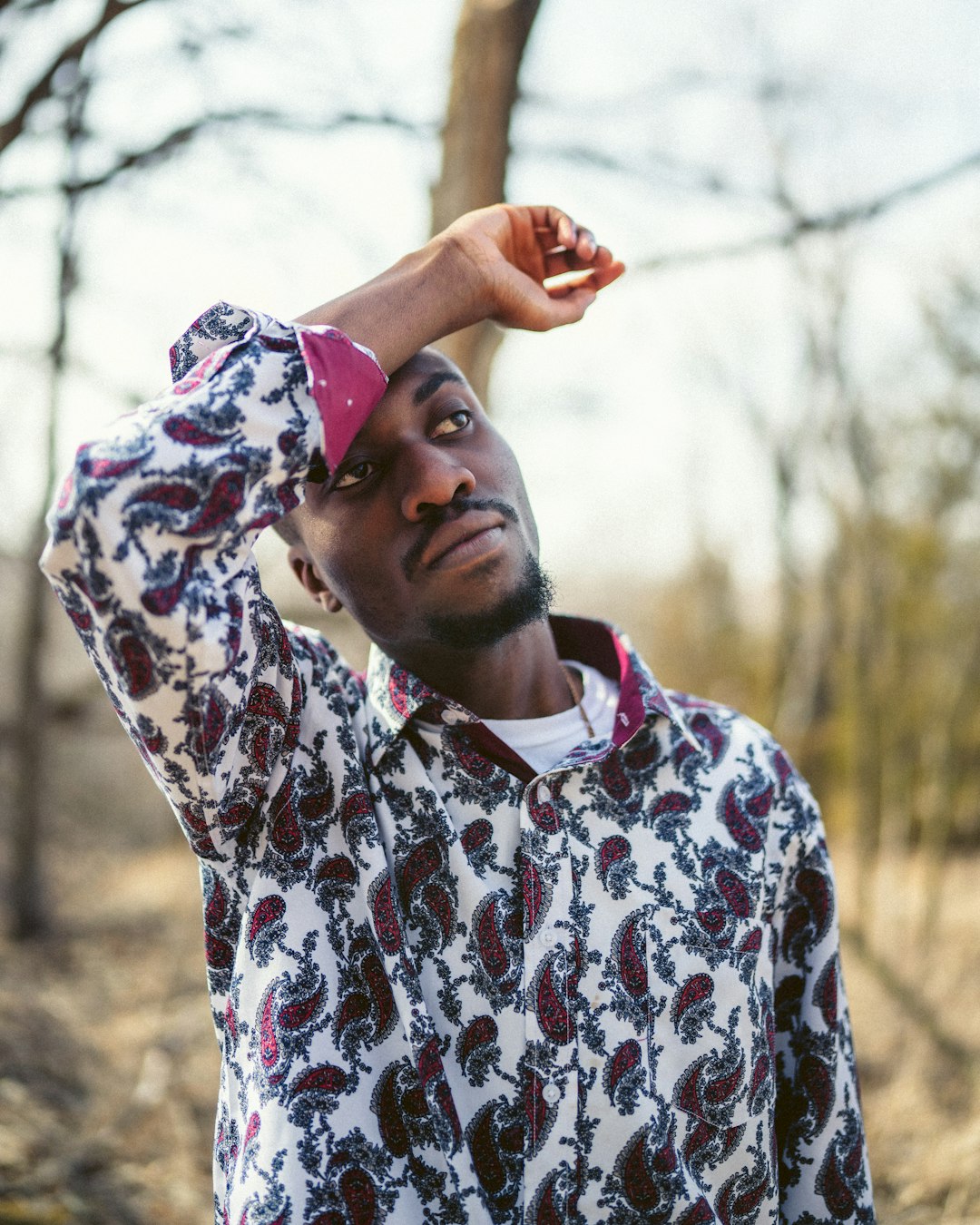 man in white and blue floral dress shirt