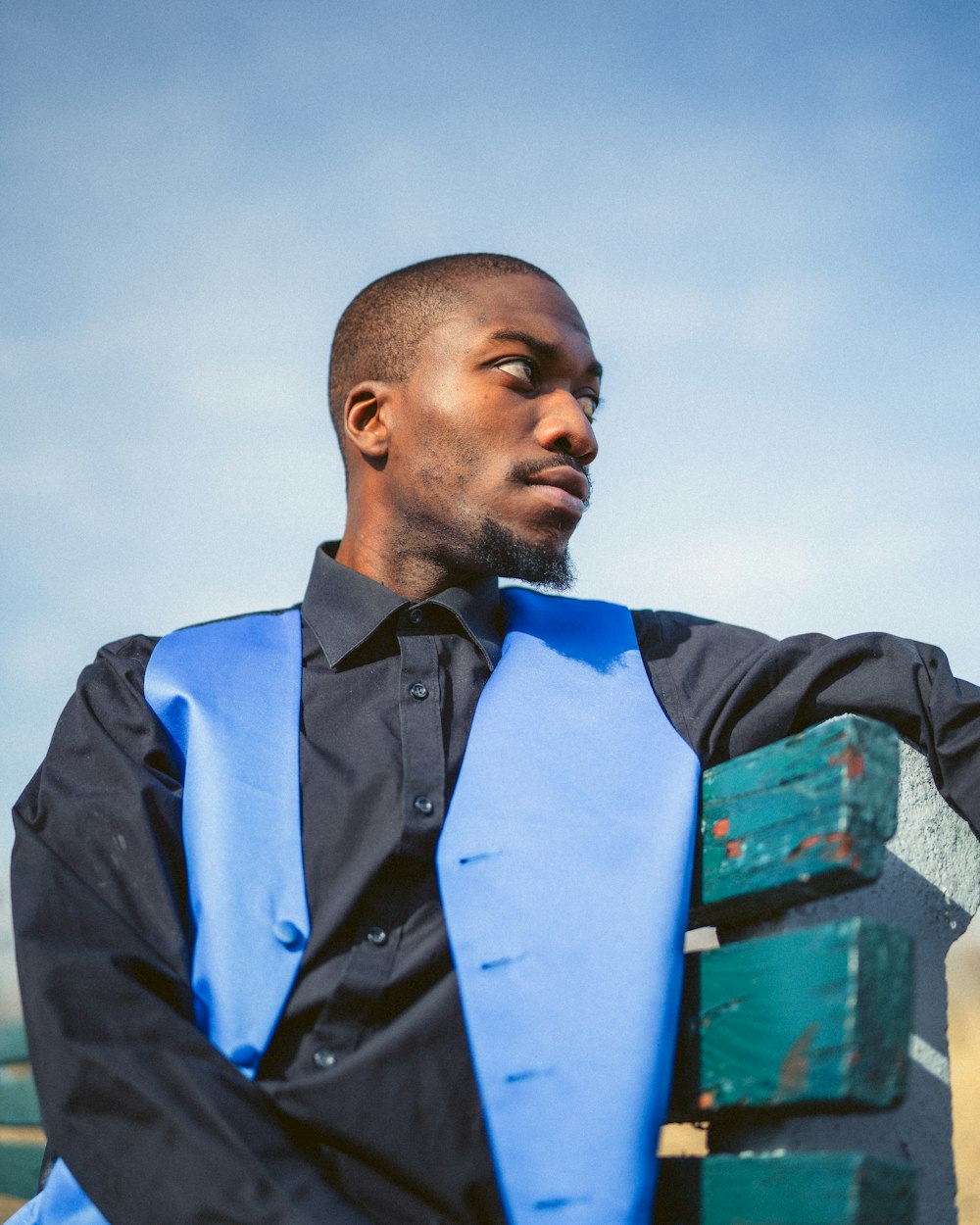 man in black jacket standing under cloudy sky during daytime