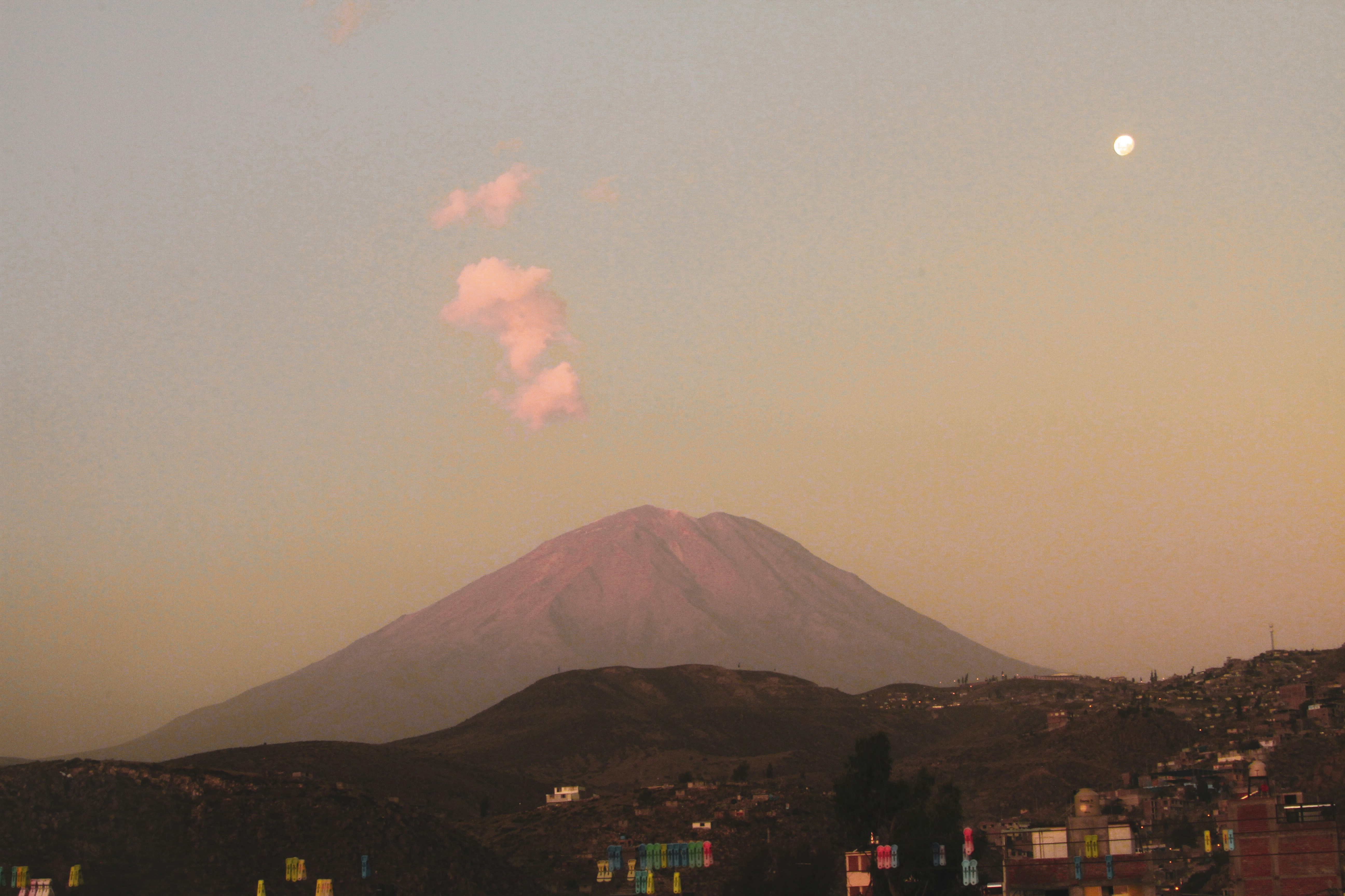 silhouette of mountain under white clouds during daytime
