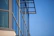 Close-up of sleek aluminum window frames reflecting a clear blue sky.